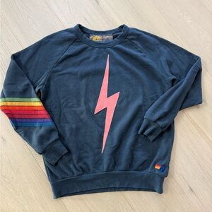 Aviator Nation Black Sweater with Red Lightning Bolt and Rainbow Sleeve